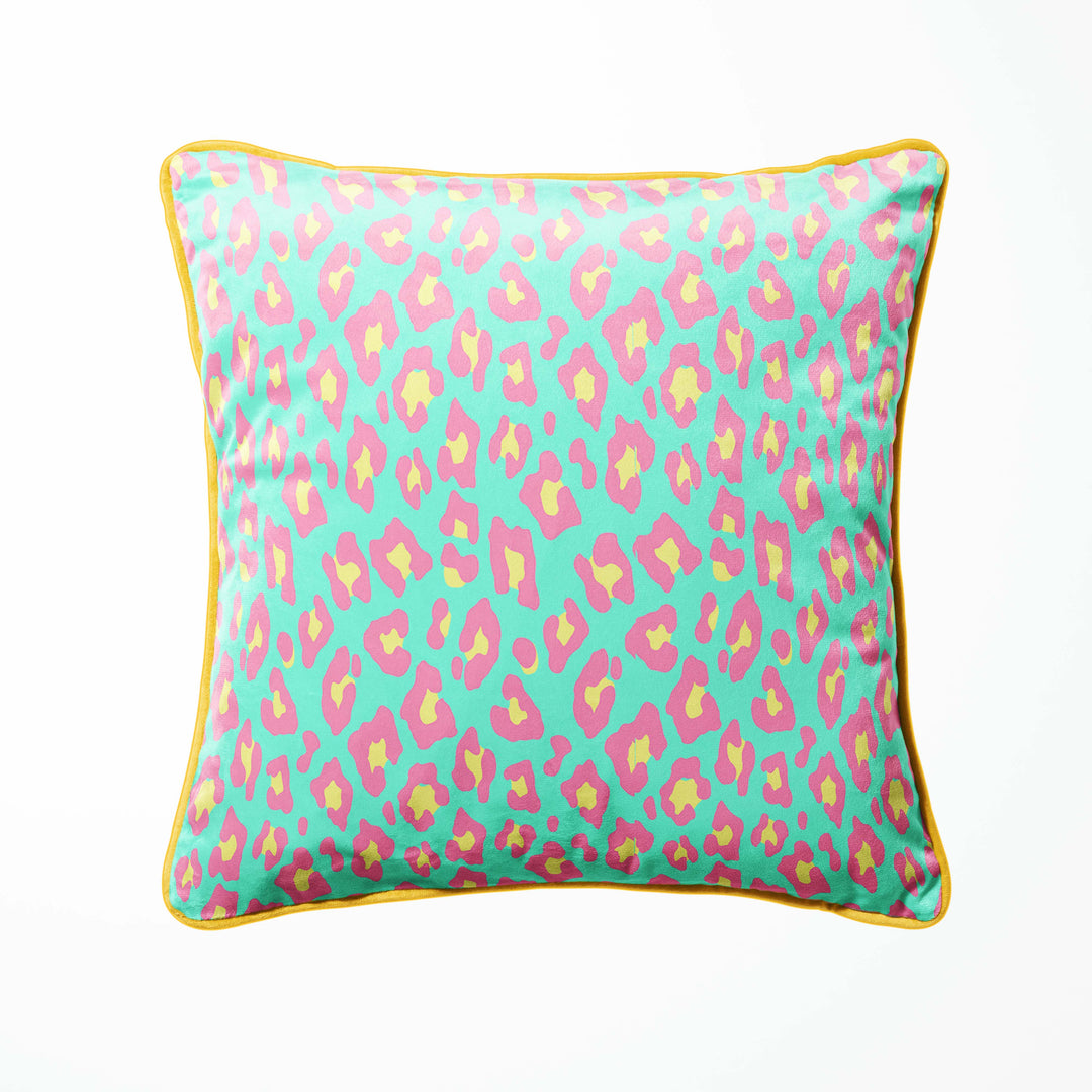 leopard print cushion in pink and green with gold piping