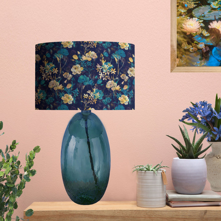 Navy Blue Gold Flower Lampshade with Mirror Gold Lining, on blue glass lamp base in salmon colour wall living room 